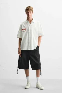 Sale CAMISA RAYAS ESTAMPADO PEGATINA Hombre Camisas