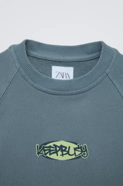 Niños ZARA 6 - 14 Años·Camisetas<CAMISETA ACID WASH ESTAMPADO