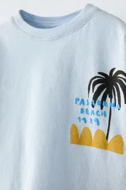 Niños ZARA 1½ - 6 Años·Camisetas|6 - 18 Meses·Camisetas<CAMISETA ESTAMPADO OLAS Y PALMERAS
