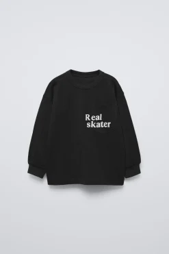 Niños ZARA 1½ - 6 Años·Camisetas|6 - 18 Meses·Camisetas<CAMISETA TEXTO FLOCK