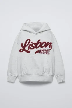 Niños ZARA 6 - 14 Años·Sudaderas<SUDADERA CAPUCHA TEXTO RIZO