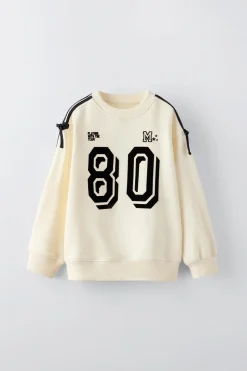 Niños ZARA 6 - 14 Años·Sudaderas<SUDADERA TEXTO FLOCK